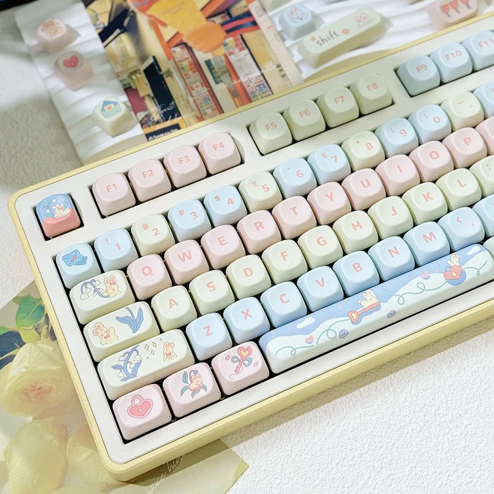 Keyboard with pastel-colored keys featuring Kawaii illustrations on a light background