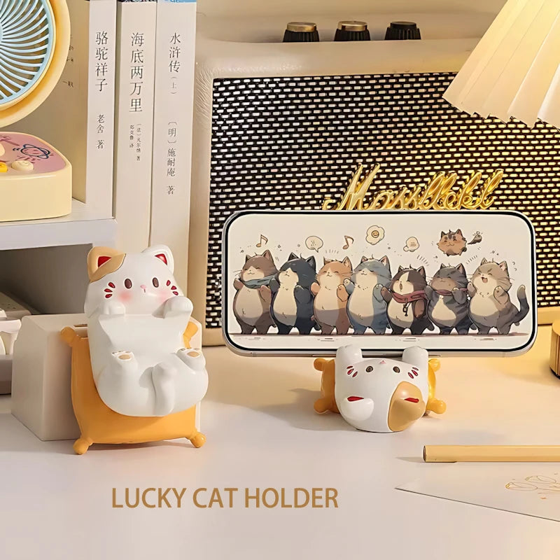 Decorative items including a lucky cat holder and a kawaii phone case with cartoon cats on a shelf.