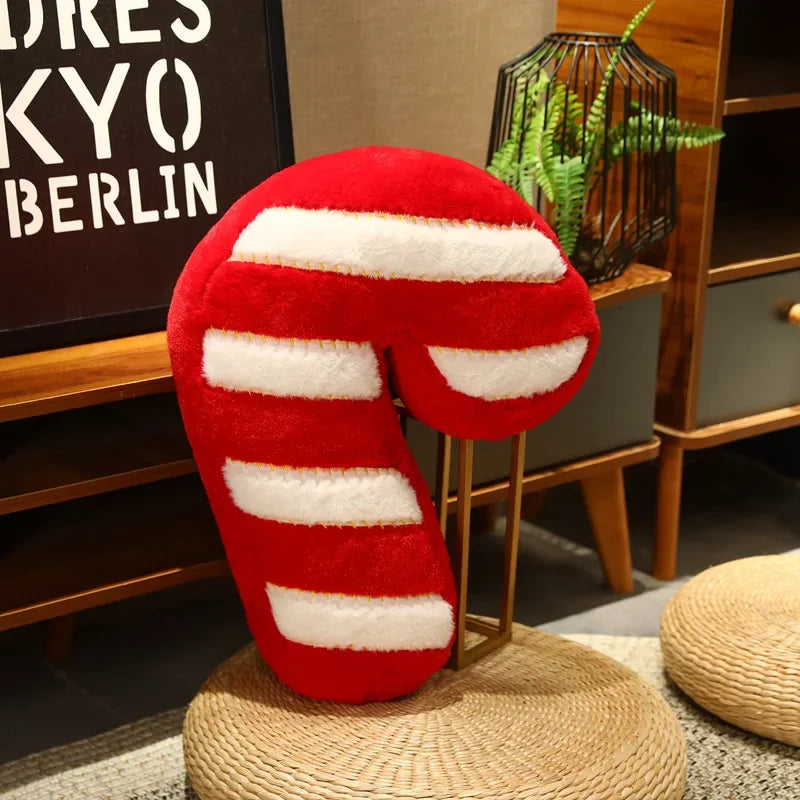 Red and white striped neck kawaii pillow on a woven stool with a plant and sign in the background