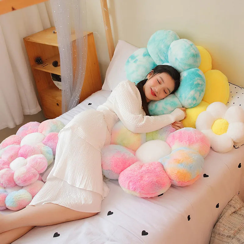 Woman lying on a bed with colorful cloud-shaped Kawaii pillows
