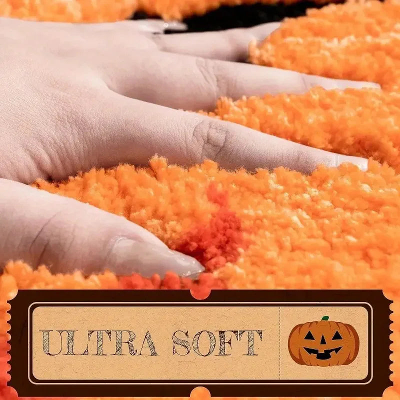 Close-up of orange plush material with a 'Ultra Soft' label featuring a Kawaii pumpkin design.