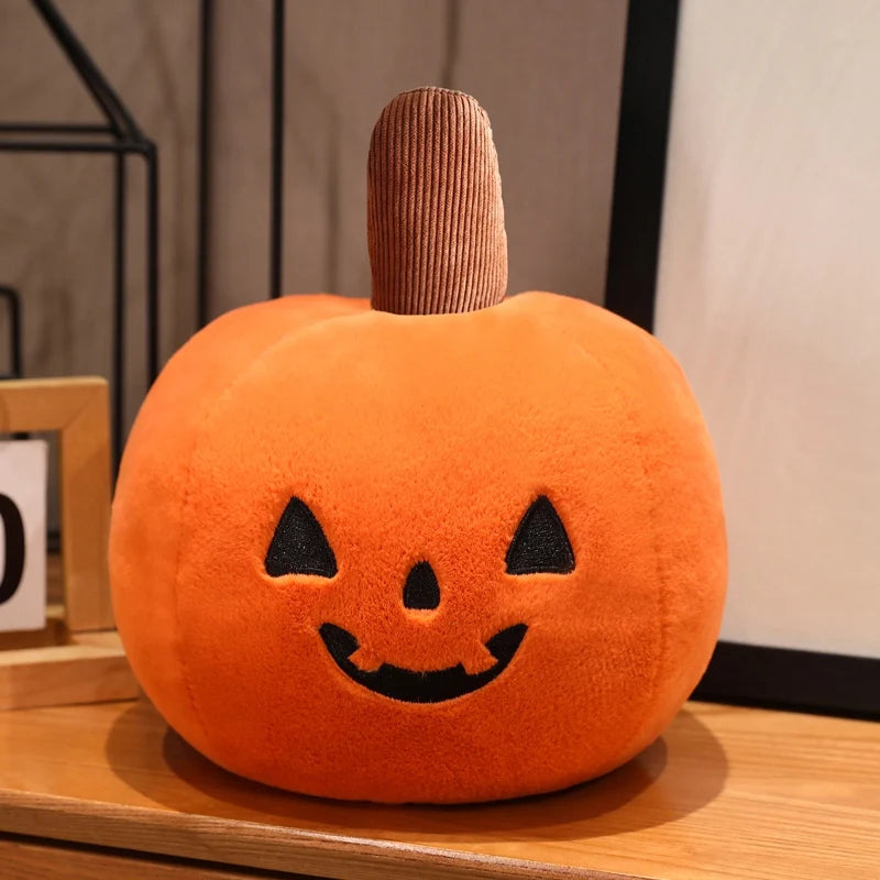 Plush pumpkin kawaii pillow with a smiling face on a wooden surface