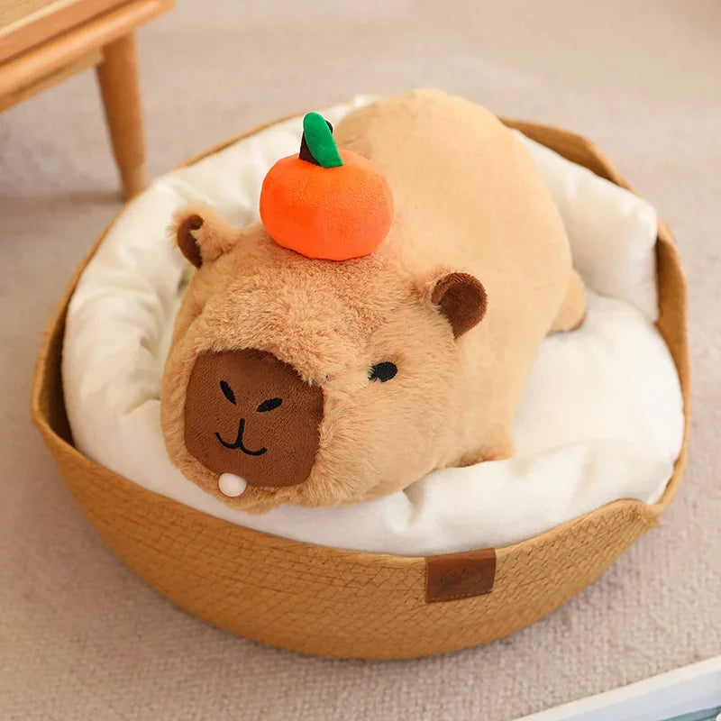 Plush toy resembling a kawaii bear with a pumpkin on its head, inside a round brown container.