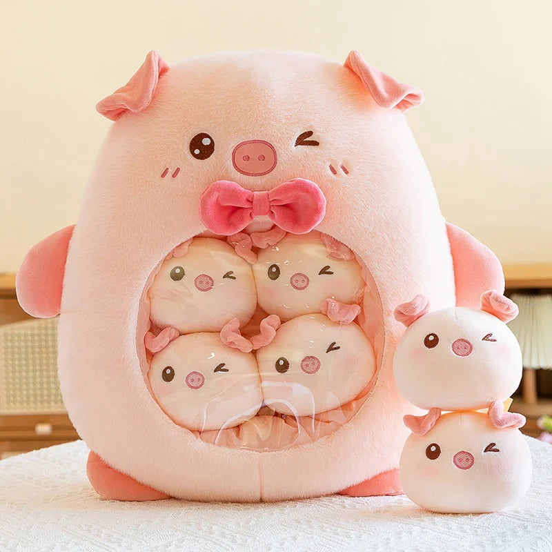 Cute pink pig kawaii plush toy with smaller pig plushies inside on a light background