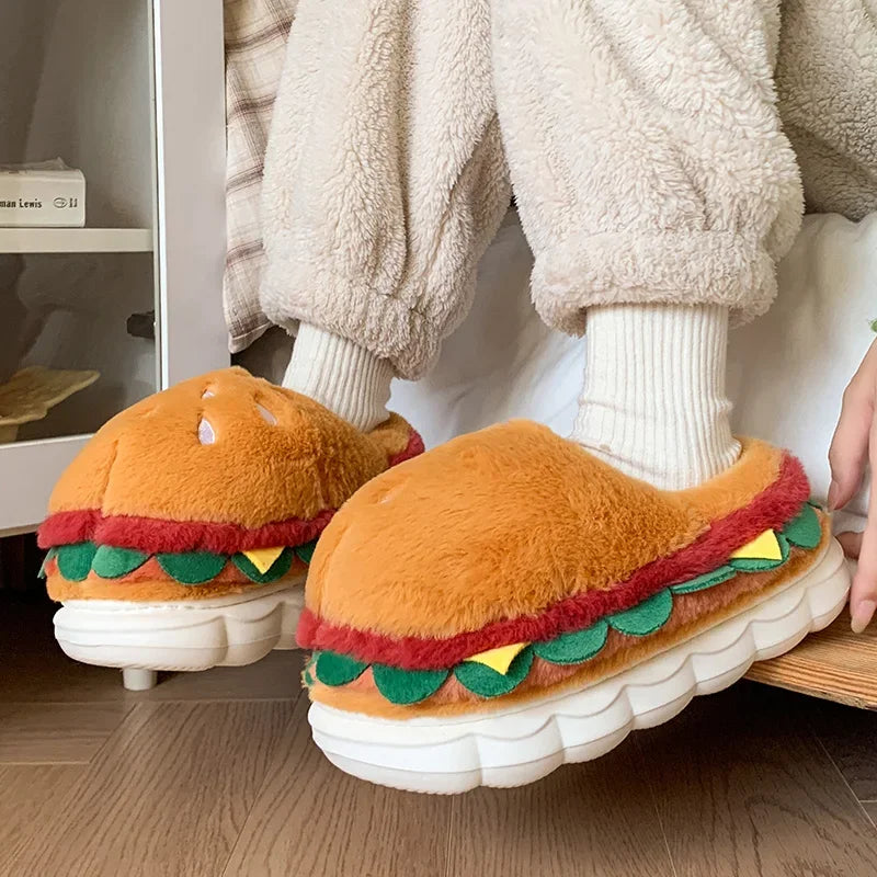 Hamburger-shaped kawaii slippers worn by a person indoors.