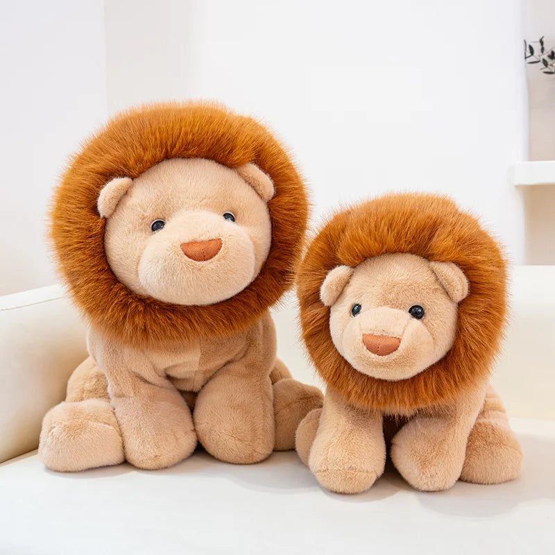 Two kawaii plush lion toys sitting on a white surface with a light background