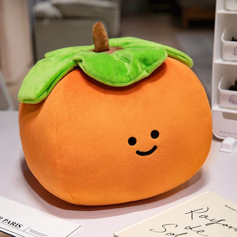 Plush kawaii toy shaped like a pumpkin with a smiley face on a surface.