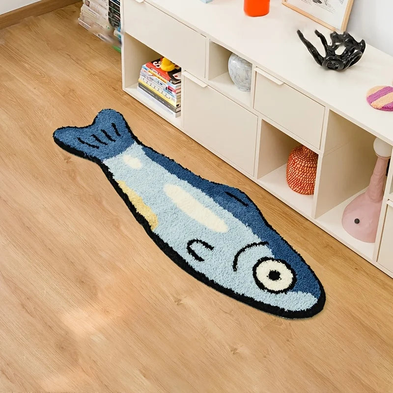 Fish-shaped kawaii rug on a wooden floor with a white cabinet in the background
