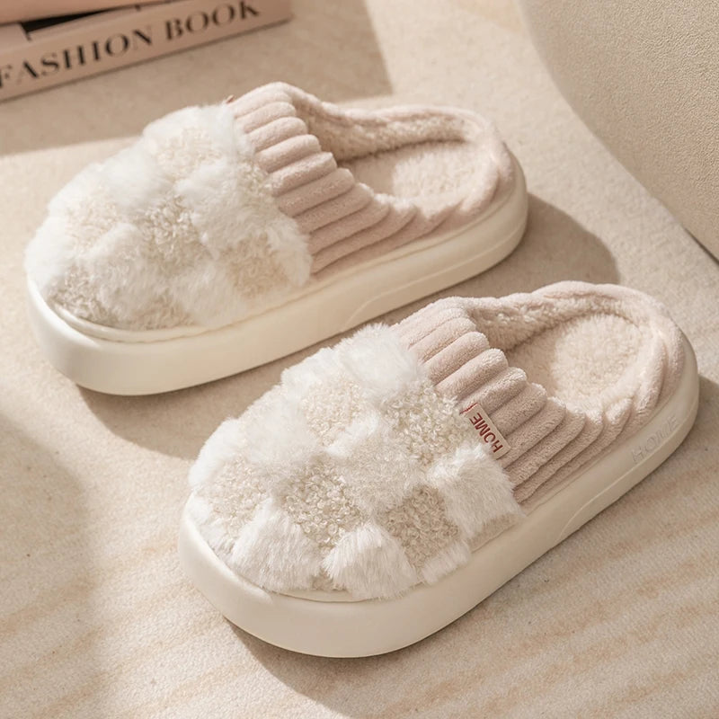 Pair of beige slippers with kawaii fluffy texture on a light background