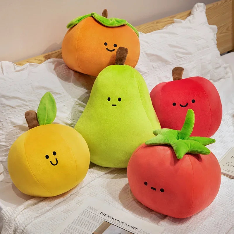 Set of kawaii plush fruit toys on a bed with a newspaper underneath