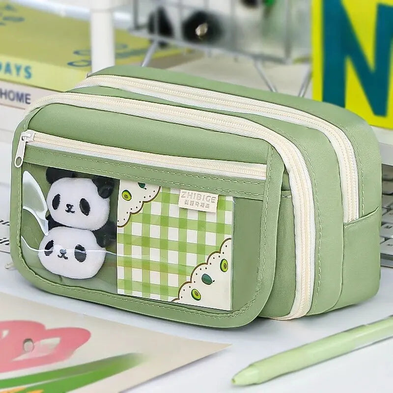 Green pencil case with kawaii panda design on a desk