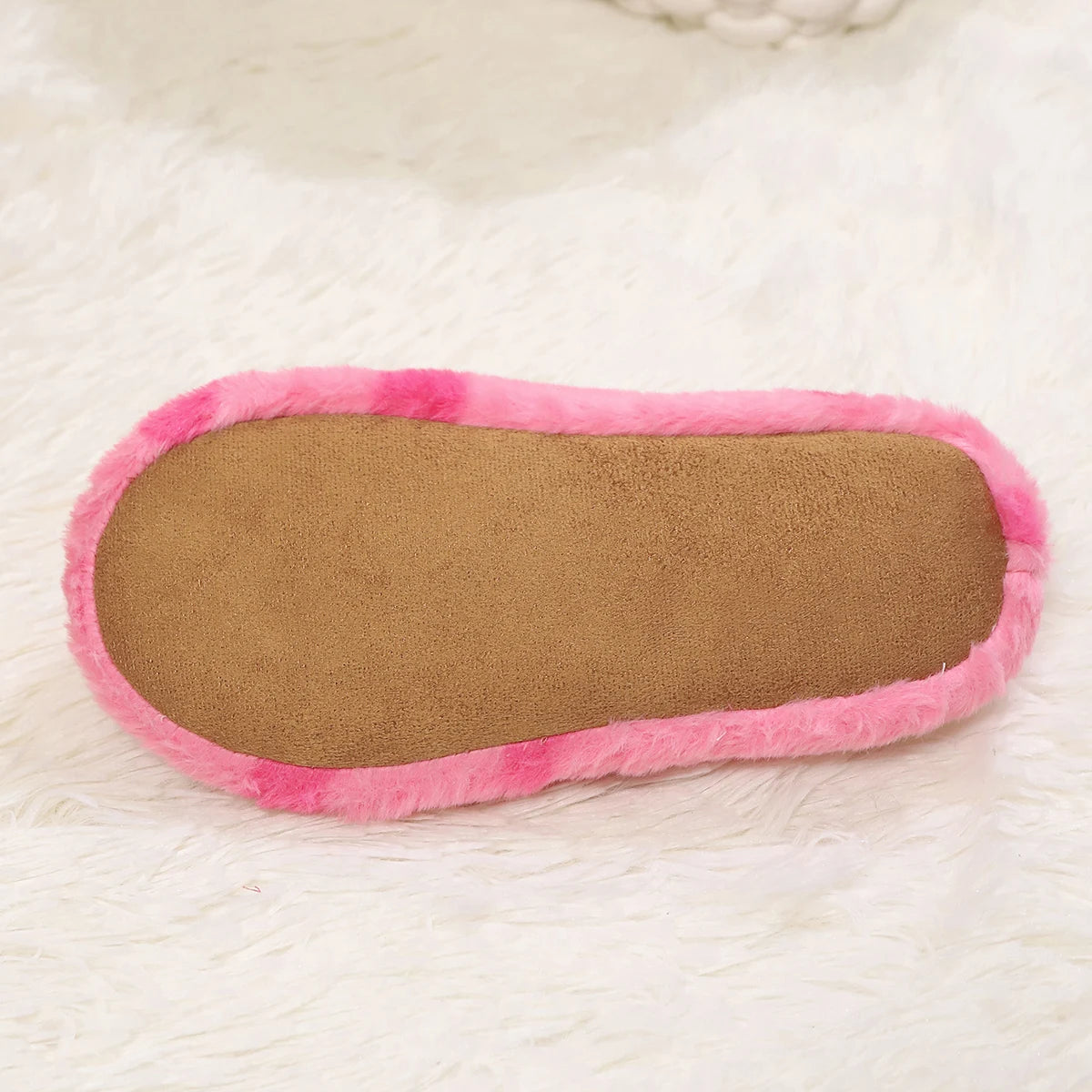 Pink and brown kawaii shoe insole on a white surface