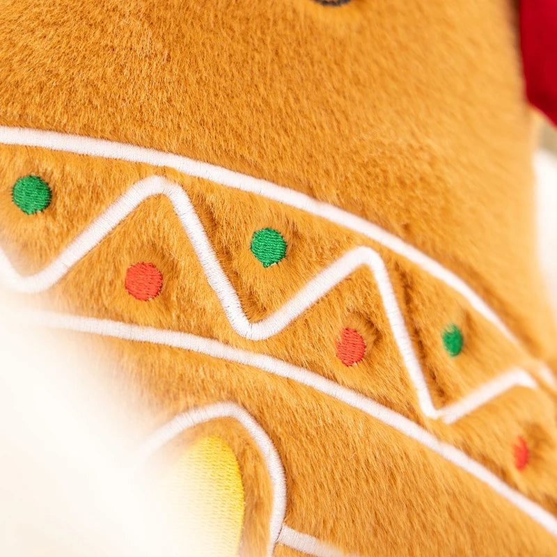 Close-up of a kawaii plush toy resembling a gingerbread man with decorative elements.