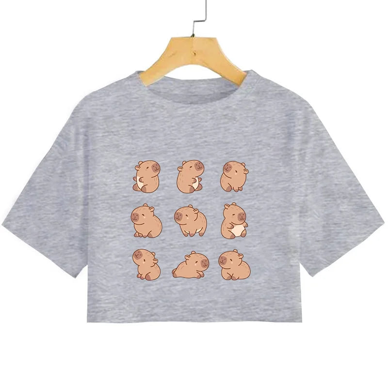 Gray t-shirt with cartoon kawaii pig designs on a hanger against a white background