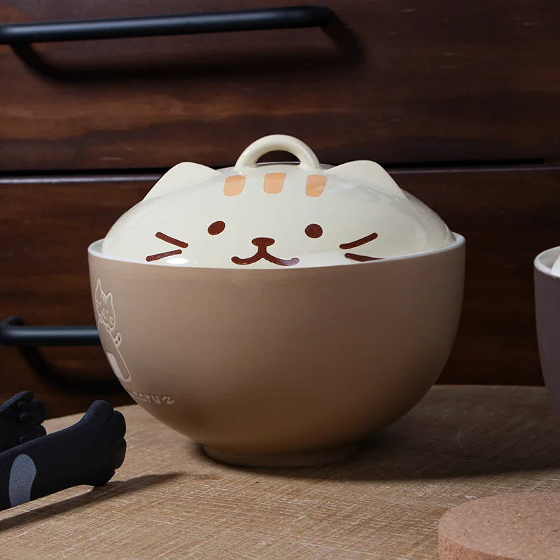 Kawaii cat-shaped ceramic bowl on a wooden surface