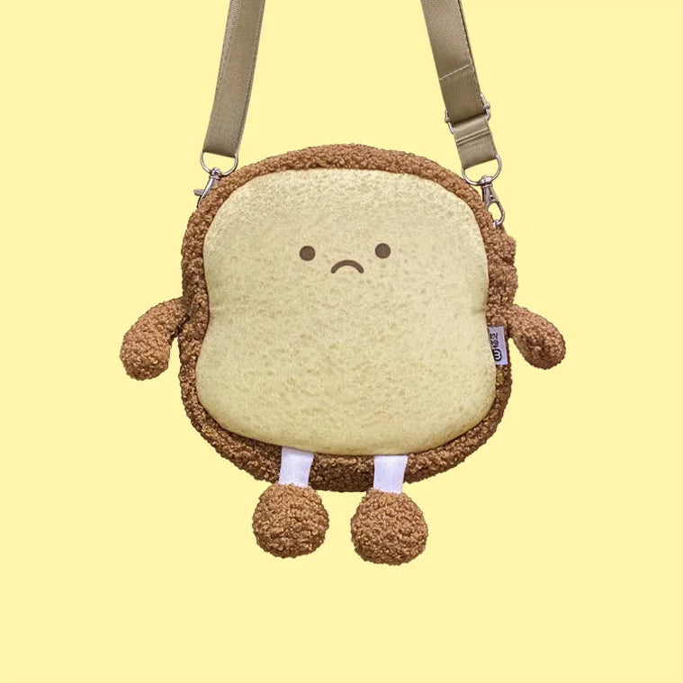 Plush bag designed like a Kawaii cartoon sandwich with a sad face on a yellow background