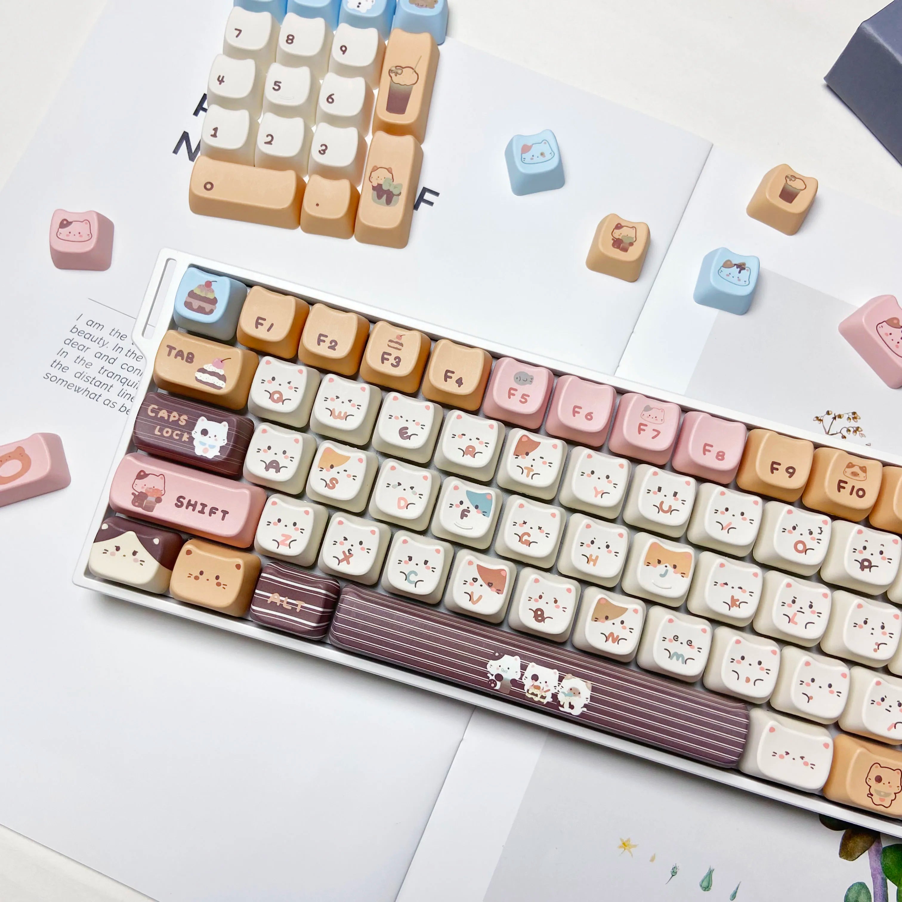 Keyboard with Kawaii animal-themed keycaps on a white surface