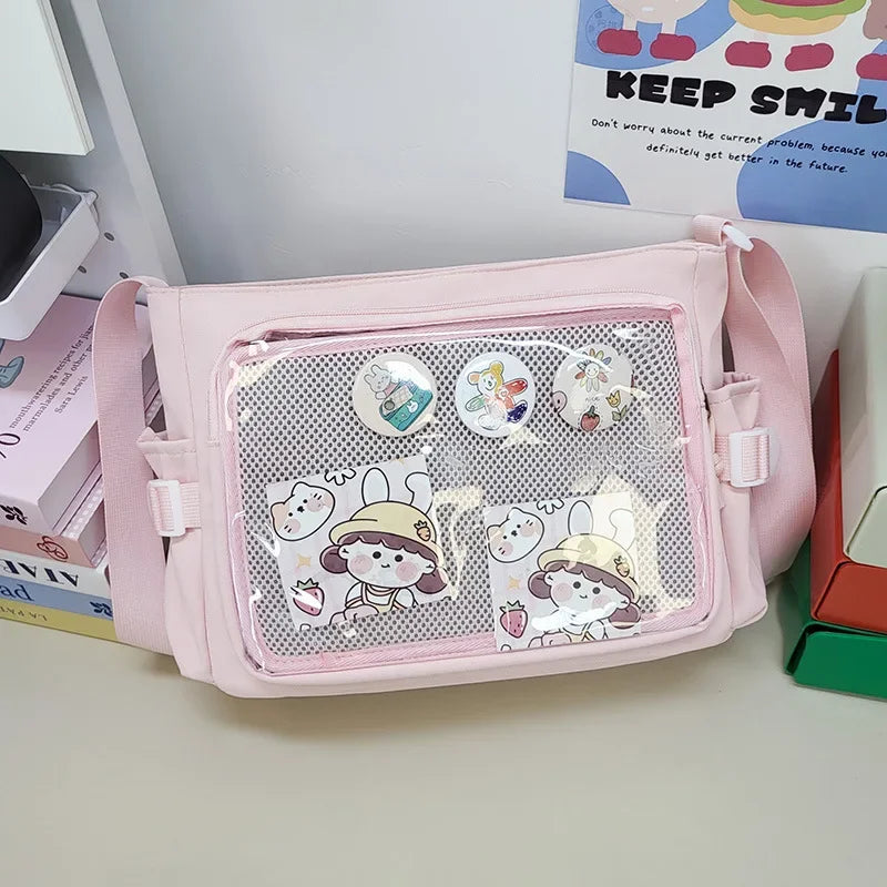 Pink pouch with cartoon Kawaii designs on a desk