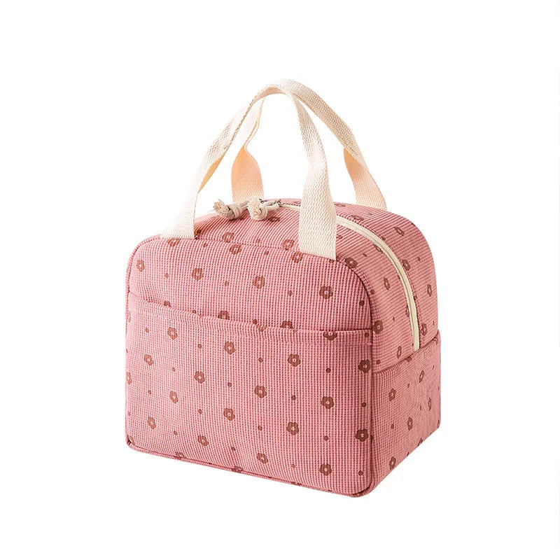 Pink kawaii floral-patterned bag with beige handles on a white background