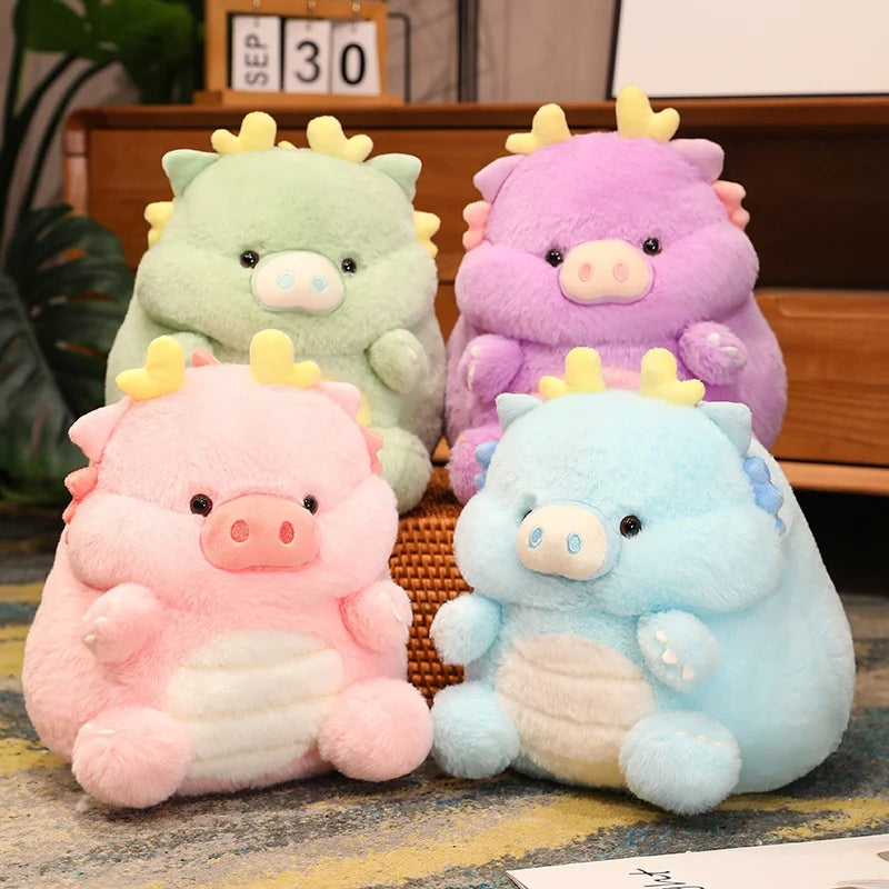 Four colorful kawaii plush toys resembling pigs on a wooden surface.
