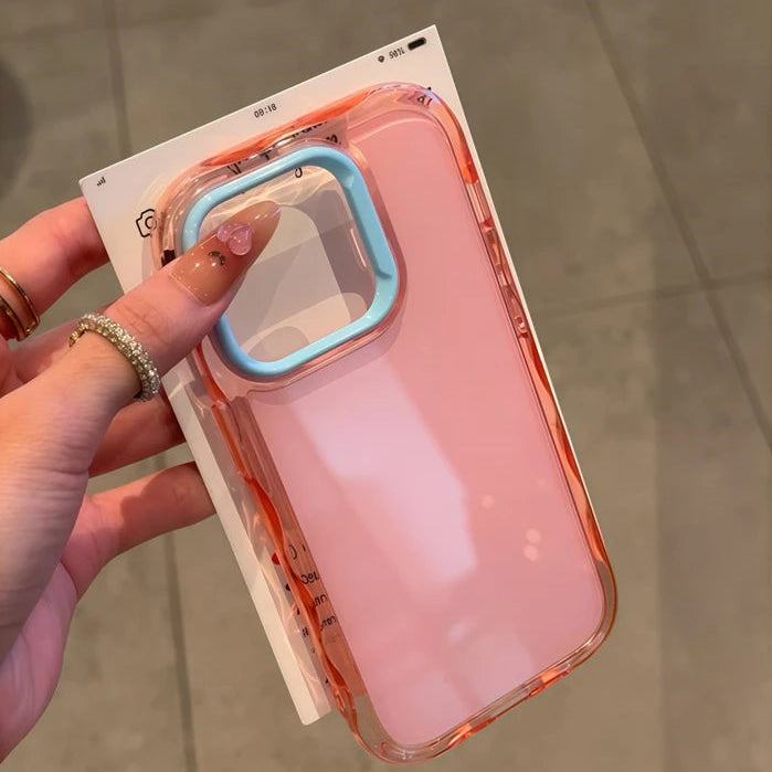 Pink kawaii phone case with clear back held by a hand on a neutral background
