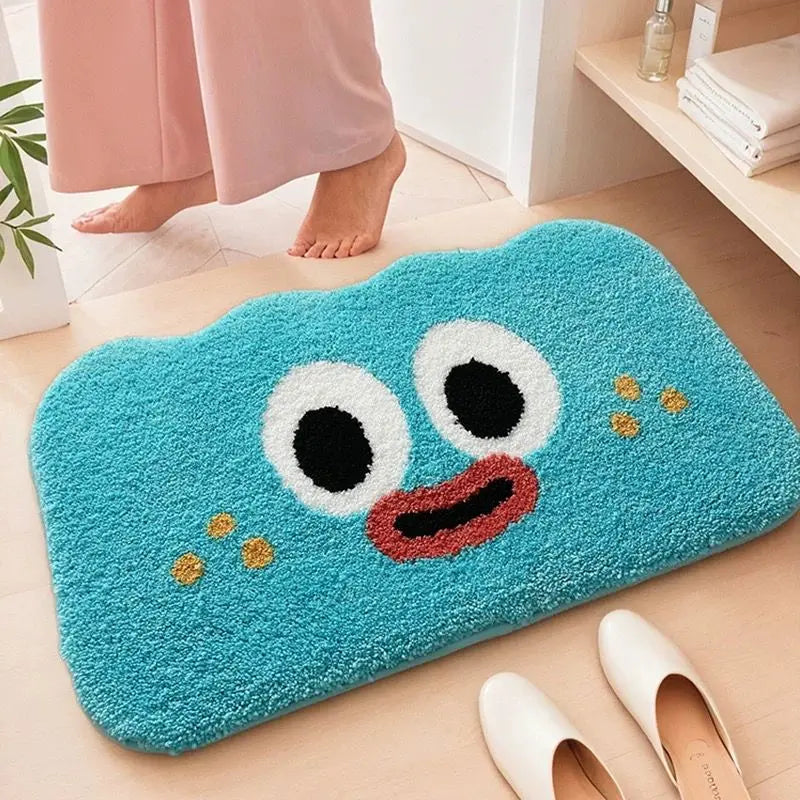 Blue Kawaii-style rug with a face design on a wooden floor.