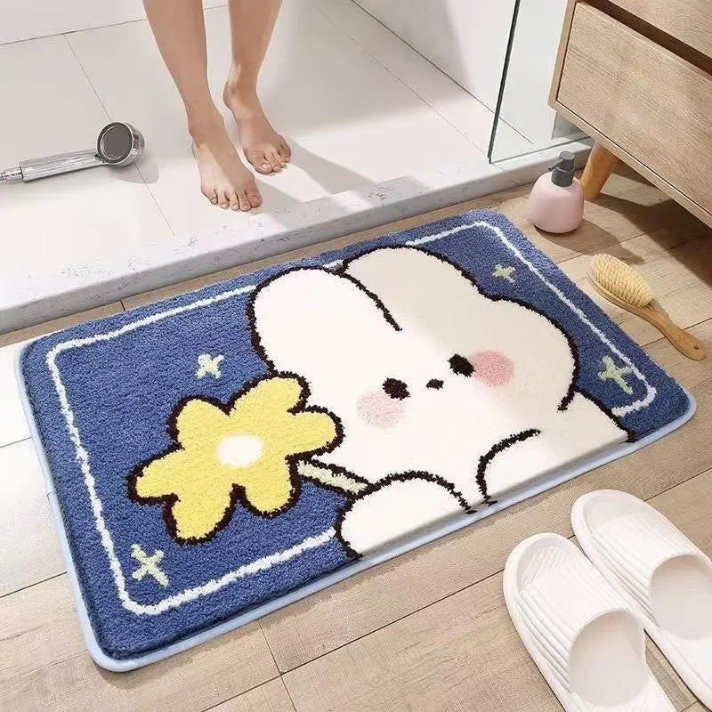 Bath mat with Kawaii cartoon bunny and flower design on a bathroom floor.
