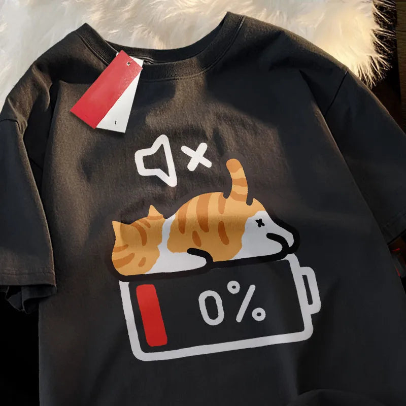 Black t-shirt with a kawaii graphic of two cats on a battery with '0%' displayed, on a textured white background.