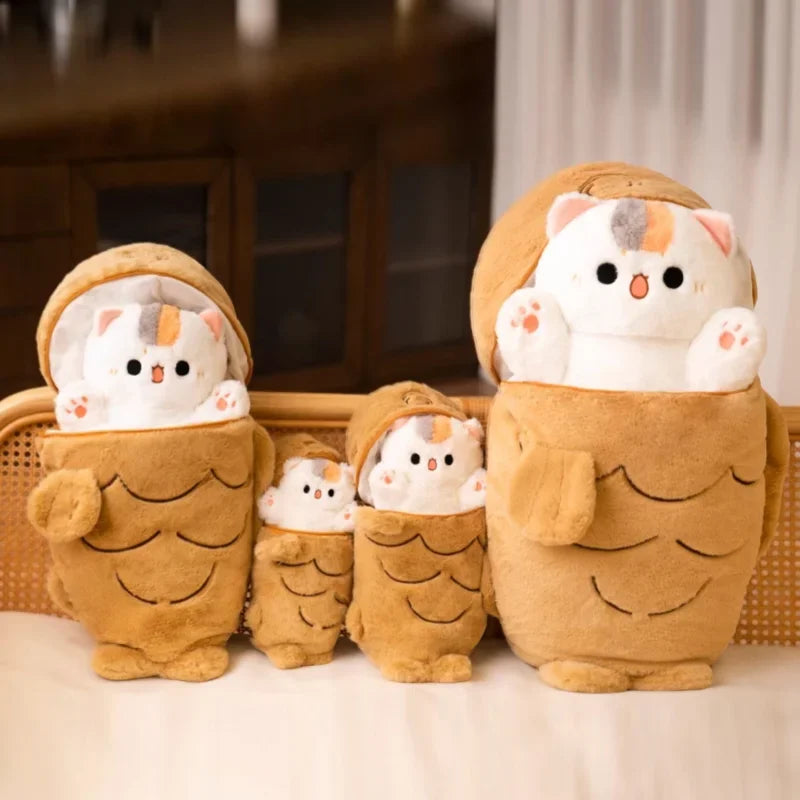 Set of plush kawaii toys resembling a family of cats in brown outfits on a light background.