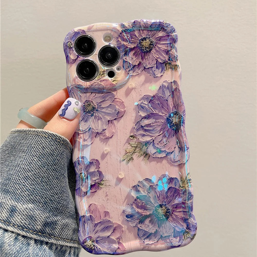 Phone case with purple kawaii floral design held by a person wearing a denim jacket.