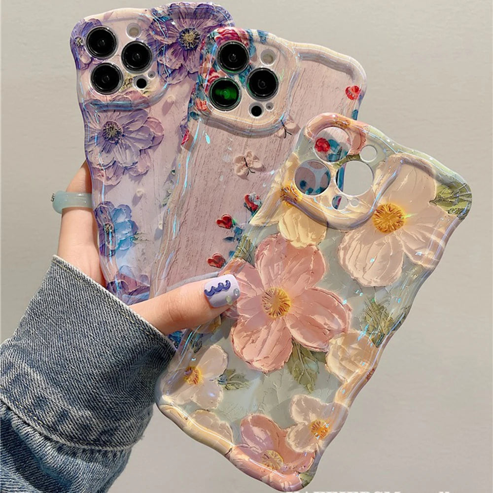 Floral kawaii phone case held by a person with a gray sleeve.