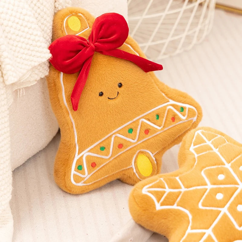 Kawaii plush gingerbread cookie with a red bow on a soft surface