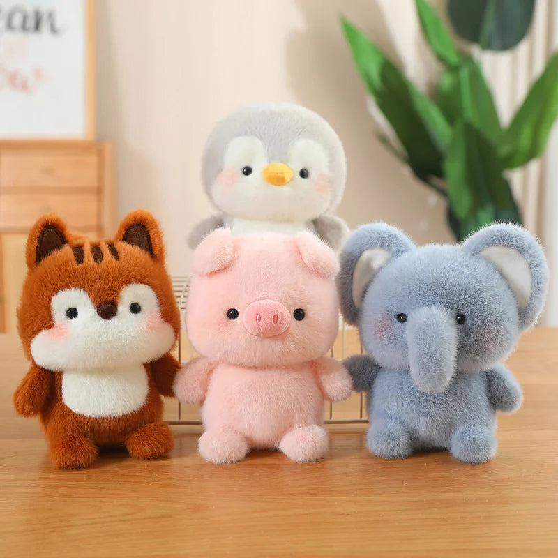 Four plush kawaii toys (fox, penguin, pig, elephant) on a wooden surface with a plant in the background.