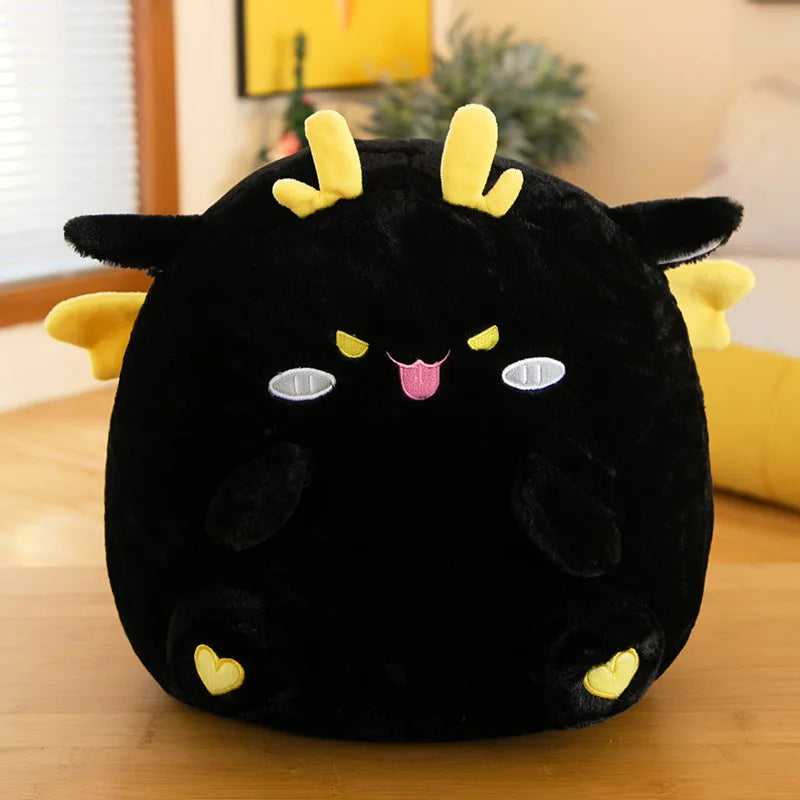 Black kawaii plush toy with yellow accents on a wooden surface