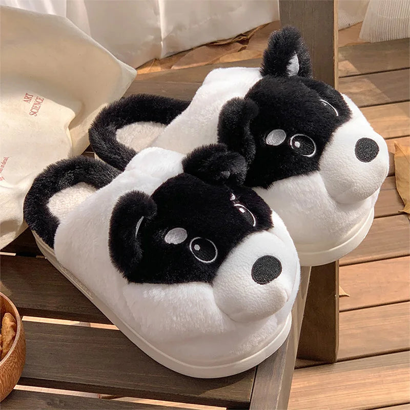 Pair of kawaii panda-shaped slippers on a wooden surface