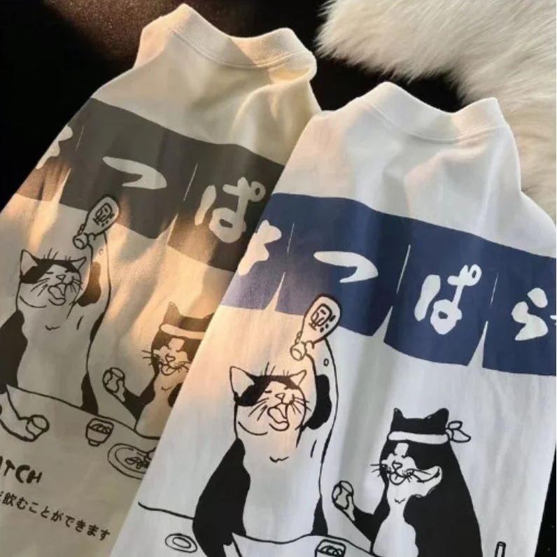 Two pairs of socks with kawaii cartoon cat designs and text on a dark background.