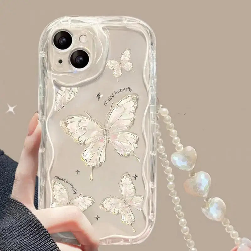 Phone case with kawaii butterfly design and chain holder held by a hand