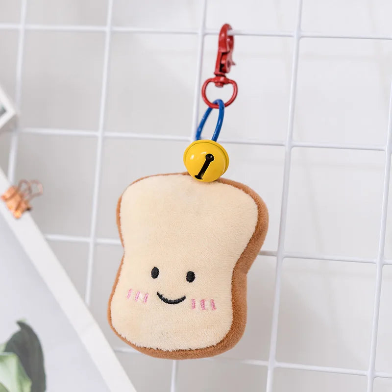 Plush kawaii toy shaped like a slice of bread with a smiley face on a white tiled background