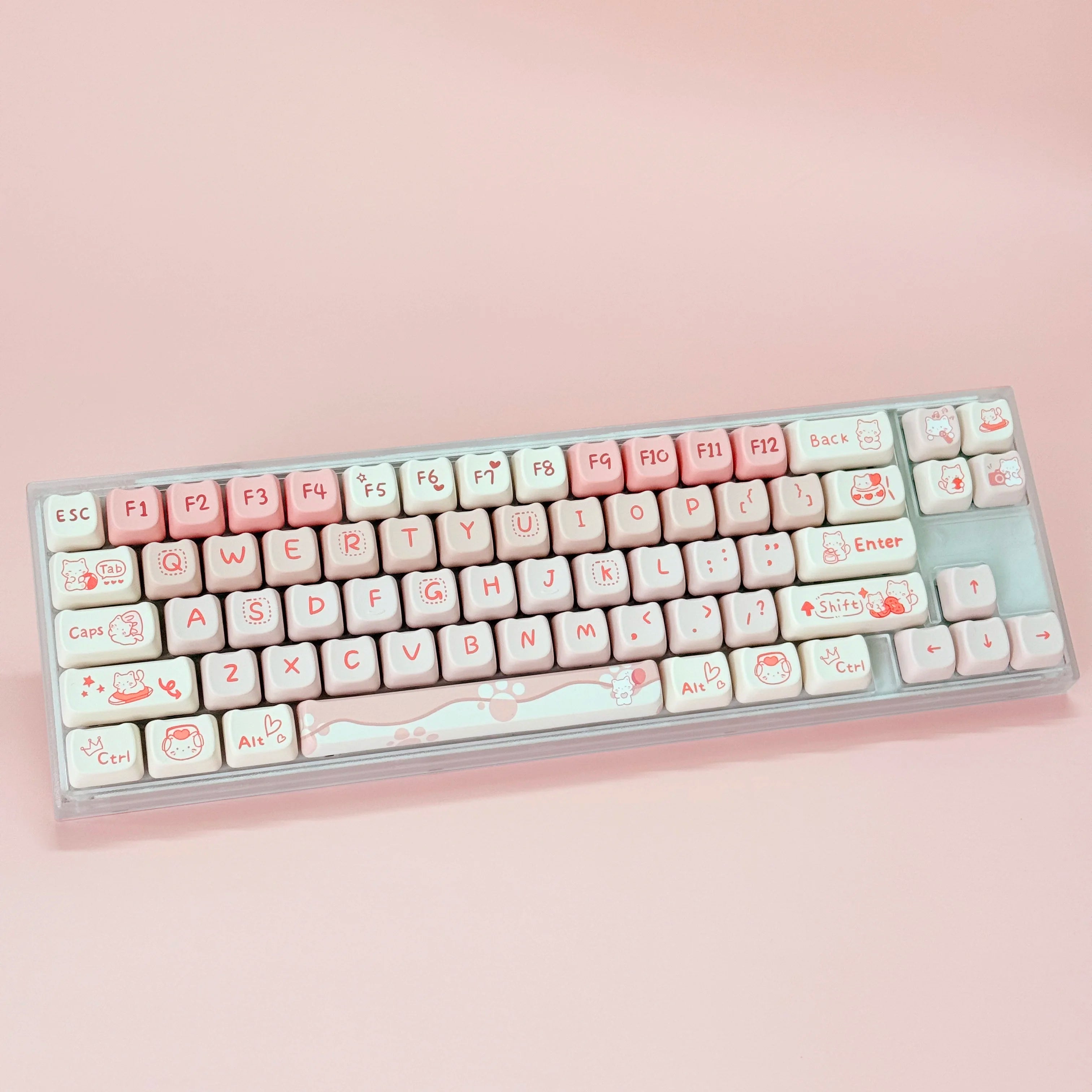 Keyboard with Kawaii character keys on a pink background