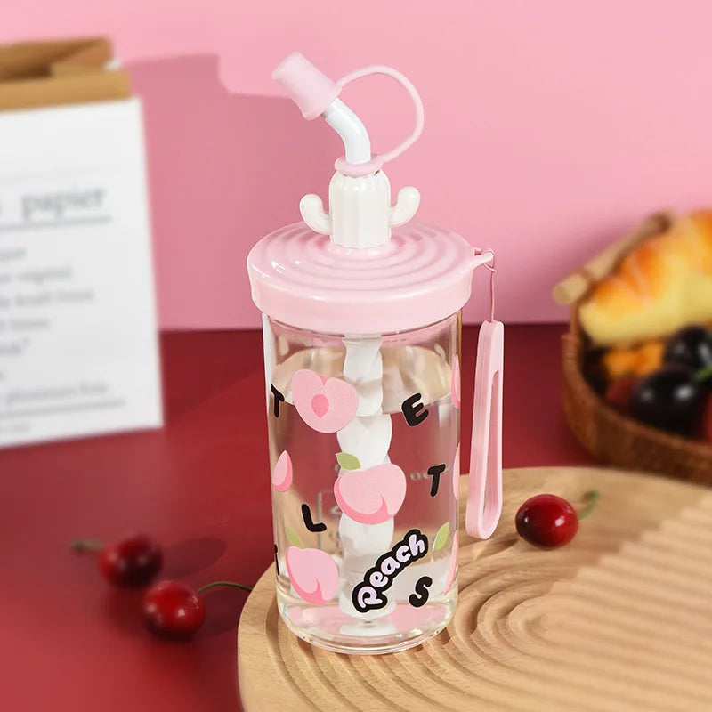 Clear water bottle with pink lid and Kawaii floral design on a pink background