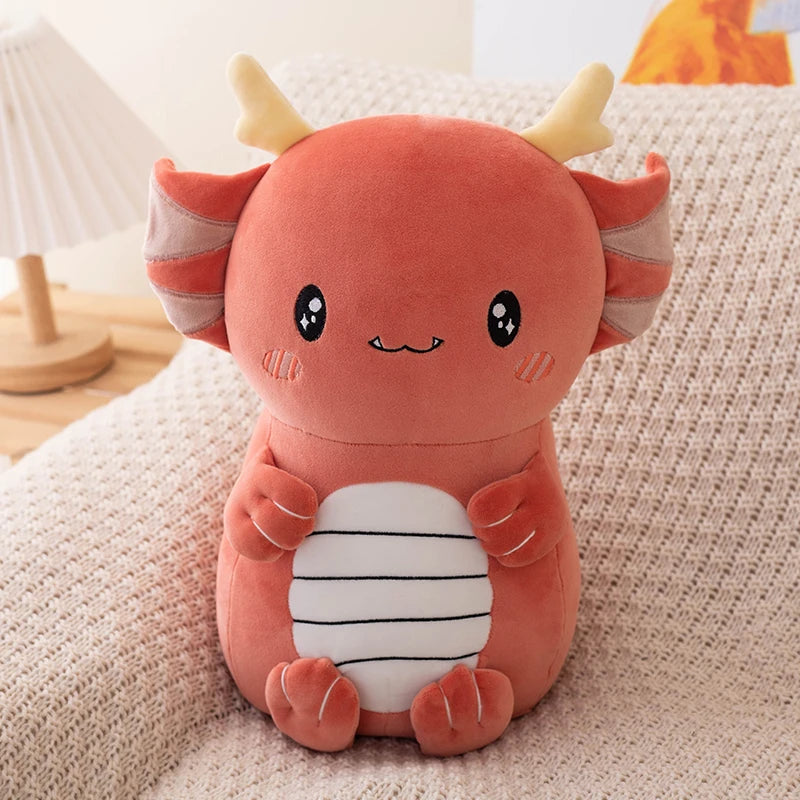 Cute kawaii plush toy with horns on a soft surface