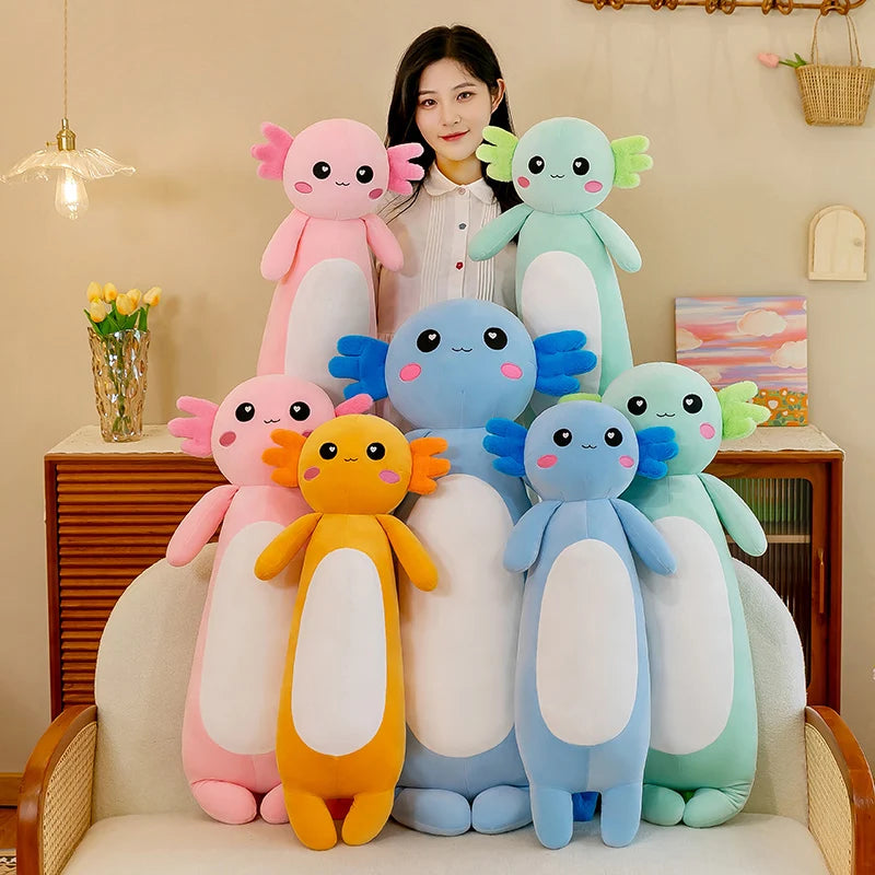 Woman sitting on a chair with colorful kawaii plush toys resembling axolotls.