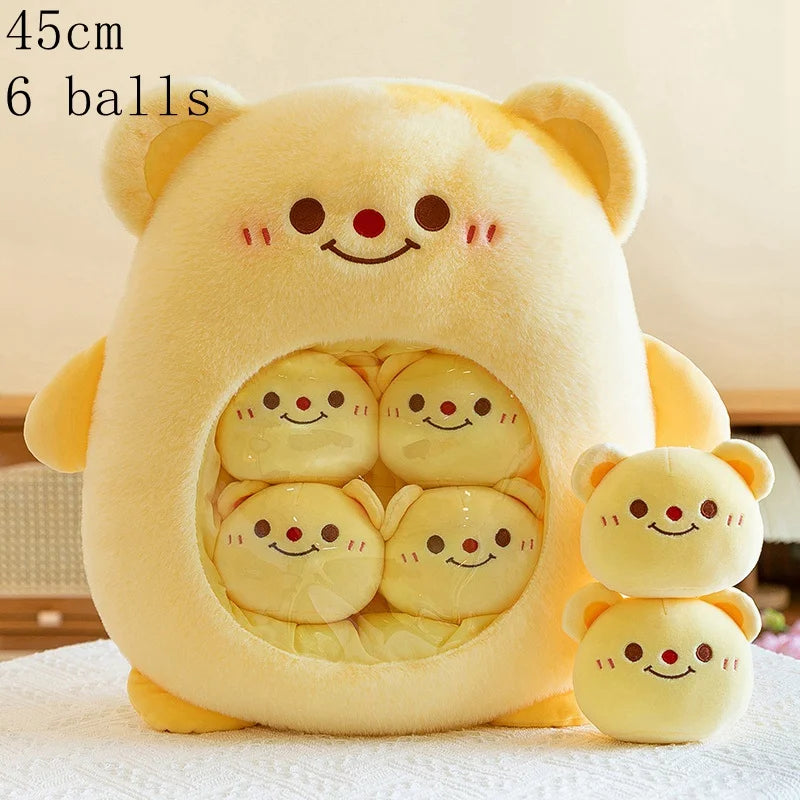 Yellow kawaii plush toy with six smaller plush toys inside on a light background