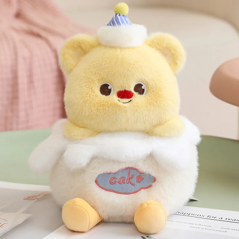 Cute plush kawaii toy bear with a birthday hat on a soft surface