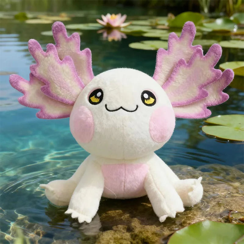 Plush kawaii axolotl toy with pink wings sitting in water with lily pads.