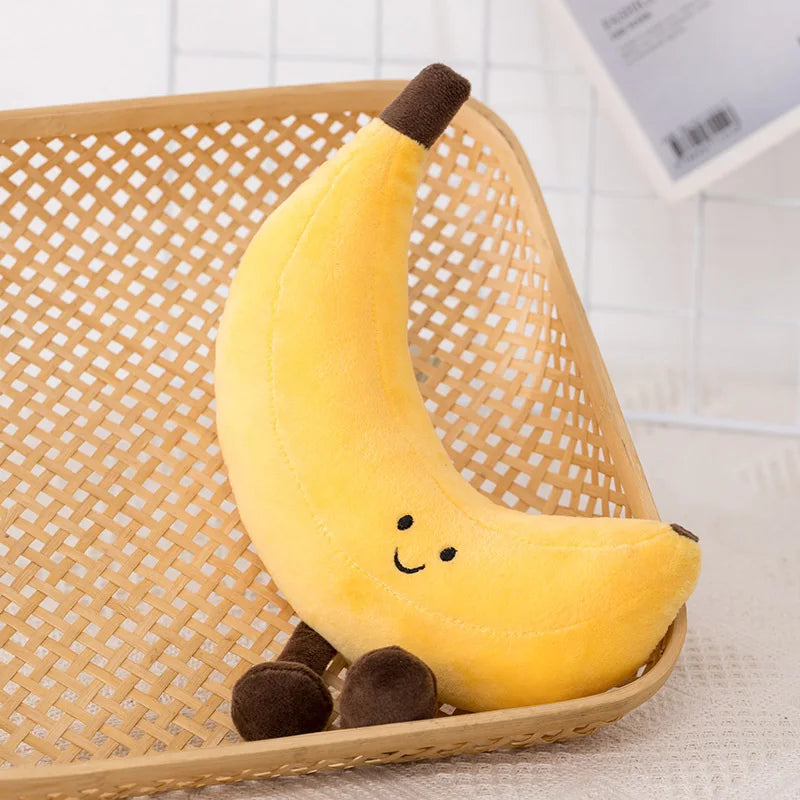 Kawaii plush banana toy with a smiley face on a woven basket