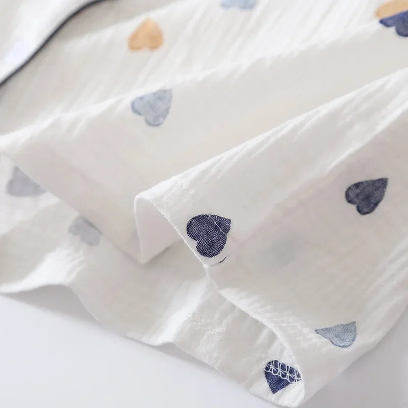 White fabric with blue kawaii heart patterns on a white background