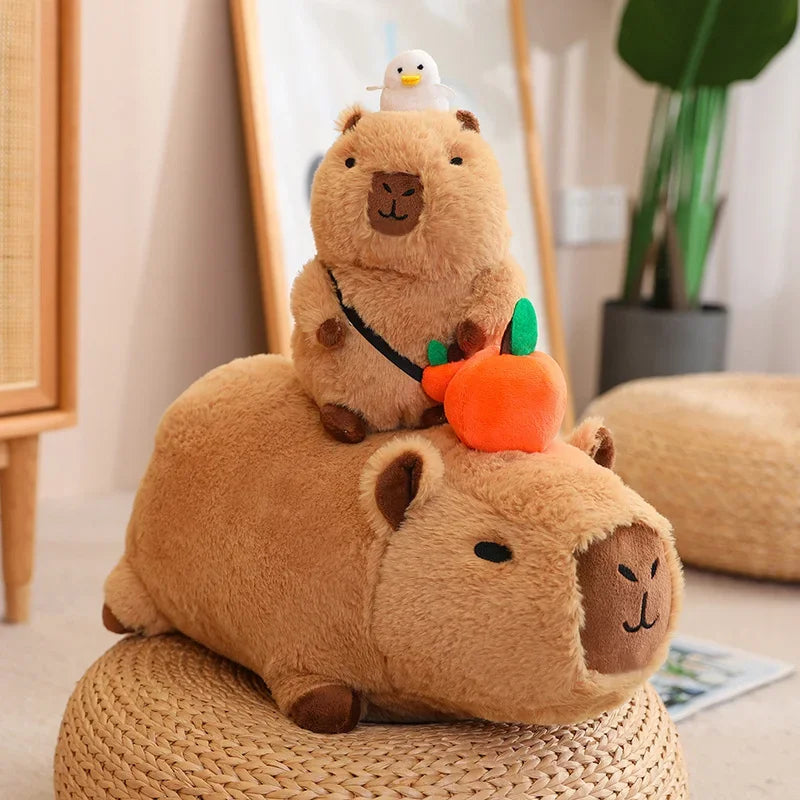 Two kawaii plush toys resembling guinea pigs on a woven stool with a small white duck on top, in a home setting.