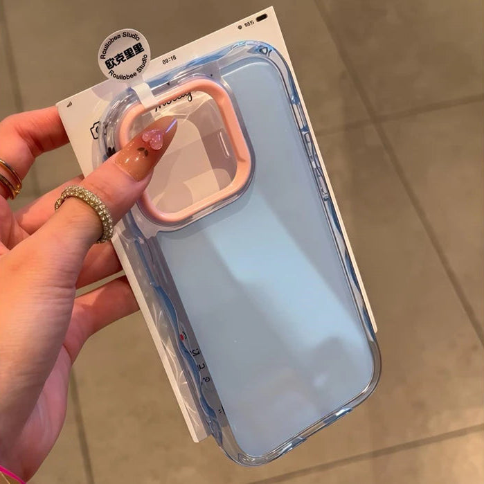 Phone case with kawaii pink handle held by a hand on a neutral background