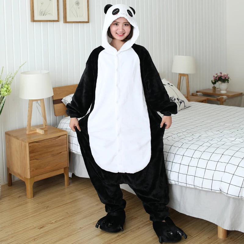 Person wearing a kawaii panda onesie in a bedroom setting
